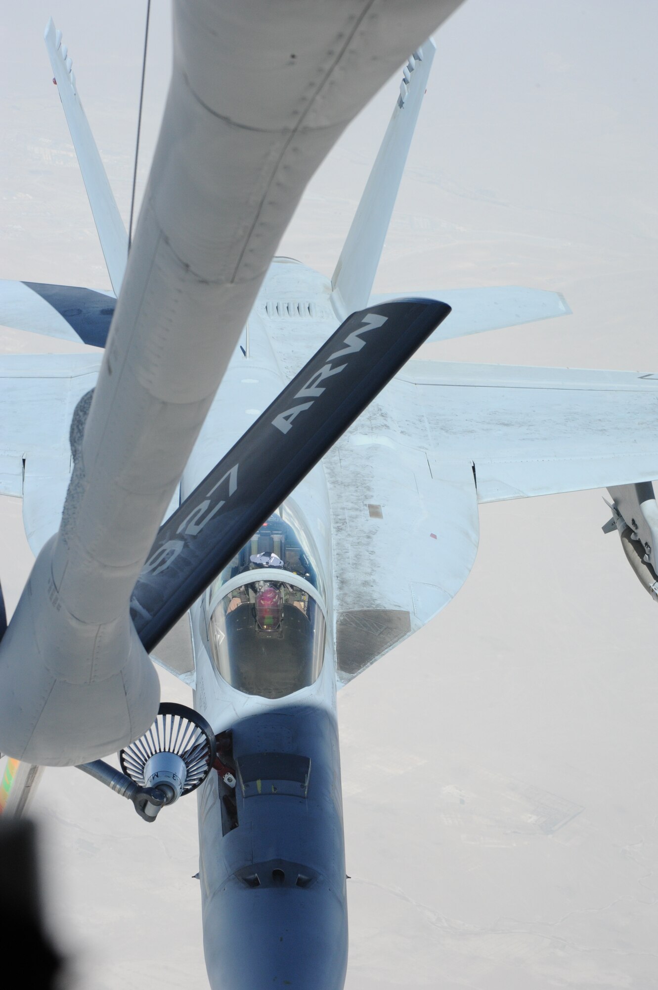 An FA-18 Super Hornet assigned to the USS George H.W. Bush, is refueled by a KC-135 Stratotanker over Afghanistan Aug 27. The KC-135 Stratotanker is assigned to the 22nd Expeditionary Air Refueling Squadron at the Transit Center at Manas, Kyrgyzstan. (U.S. Air Force photo/Tech. Sgt. Hank Hoegen)
