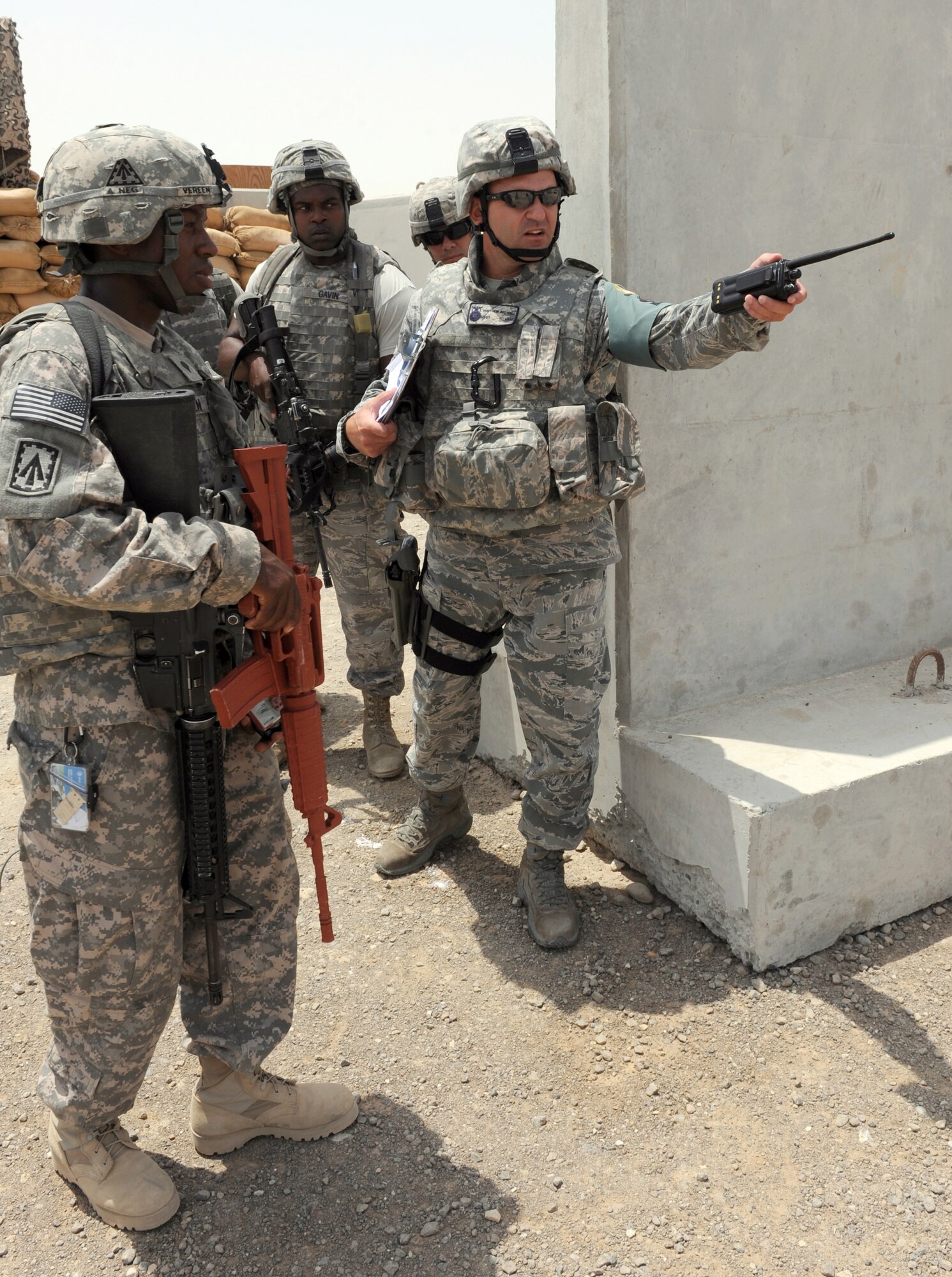 Master Sgt. Matthew Bedwell, from the 380th Expeditionary Security Forces Squadron, gives a pre-briefing to quick reaction force members from the U.S. Army's 3rd Battalion, 4th Air Defense Artillery Regiment during an active shooter exercise at the 380th Air Expeditionary Wing Aug. 24, 2011. (U.S. Air Force photo/Master Sgt. Chance Babin)