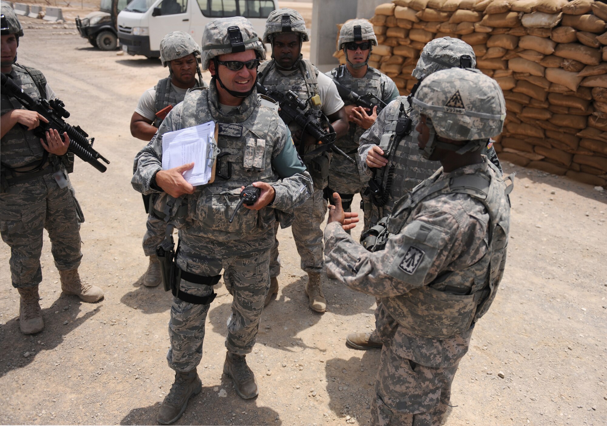 Master Sgt. Matthew Bedwell, from the 380th Expeditionary Security Forces Squadron, gives a pre-briefing to quick reaction force members from the U.S. Army's 3rd Battalion, 4th Air Defense Artillery Regiment during an active shooter exercise at the 380th Air Expeditionary Wing Aug. 24, 2011. (U.S. Air Force photo/Master Sgt. Chance Babin)
