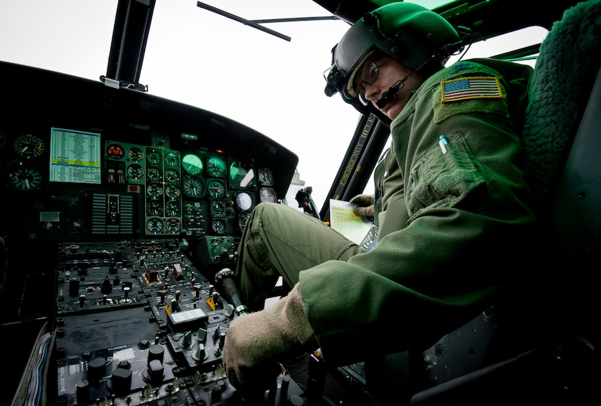 YOKOTA AIR BASE, Japan -- Lt. Col. Joshua Bowman, 459th Airlift Squadron director of operations, runs through pre-flight checklists in a UH-1N Iroquois Aug. 21, 2011, during the Japanese-American Friendship Festival at Yokota Air Base, Japan. (U.S. Air Force photo/Staff Sgt. Samuel Morse)