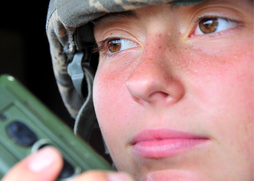 Airman 1st Class Leslie Gerbes, 51st Security Forces Squadron member, calls in a radio check while securing an entry control point Aug. 30, 2011 during exercise Beverly-Midnight 11-04. Exercises, such as this, sharpen Osan's ability to survive and operate during combat.  (U.S. Air Force photo/Senior Airman Adam Grant)  