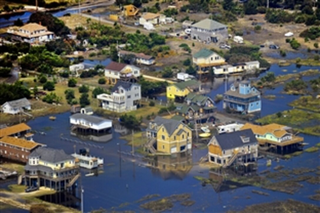 A Coast Guard C-130 Hercules fixed-winged aircraft provides an aerial view of areas affected by Hurricane Irene near Oregon Inlet in Elizabeth City, N.C., Aug. 29, 2011. The C-130 crew is assigned to Coast Guard Air Station Elizabeth City. The Coast Guard is providing overflights to assist state and local agencies as part of the joint response to the hurricane.