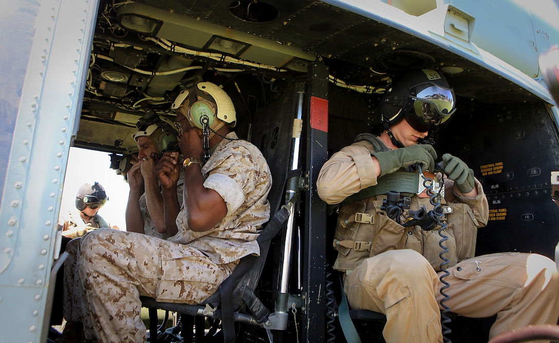 Major General Ronald L. Bailey, commanding general, 1st Marine Division, prepares for an aerial tour of Camp Pendleton’s ranges and individual training lanes Aug. 24, 2011, aboard a UH-1 utility helicopter. Major General Bailey toured with Maj. Gen. David H. Berger, assistant division commander, both flown by Marines with Marine Light Attack Squadron 169. Camp Pendleton’s ranges have gone through significant modernization initiatives since 2005, including development of improvised explosive device training areas and live-fire ranges. First Marine Division’s leadership was able to become familiar with what Camp Pendleton offers to Marines training for combat.