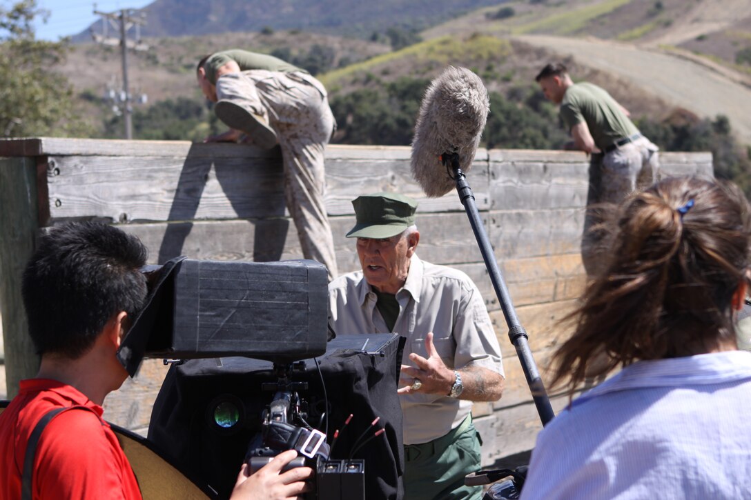 Retired gunnery sergeant and actor R. Lee Ermey shoots a television scene, which will be featured weekly on ESPN’s College Game Day, at an obstacle course located on Camp Pendleton’s School of Infantry-West, Aug. 30.  Ermey’s role calls for him to insult sports analysts who pick the wrong winning team the week prior. During his time on base, Ermey visited Marines at the Staff Non commissioned Officer’s Academy to sign autographs and pose for pictures.
