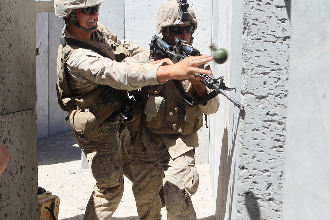 Two Marines with 3rd Light Armored Reconnaissance Battalion, practice room clearing procedures at the Combat Center’s Range 111 Aug. 30, 2011.