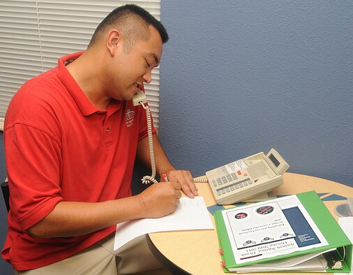 Senior Airman Enrico Javier, 49th Test and Evaluation Squadron, answers a call for Airmen Against Drunk Driving in the Blue Room of the Stratofortress dorm on Barksdale Air Force Base, La., Aug. 28. AADD is a free service to drive Airmen home if they've been drinking and their "get home safe" plan falls through. AADD mans the Blue Room Friday and Saturday night from 11:30 p.m. to 4 a.m. (U.S. Air Force photo/Senior Airman Kristin High) (RELEASED)