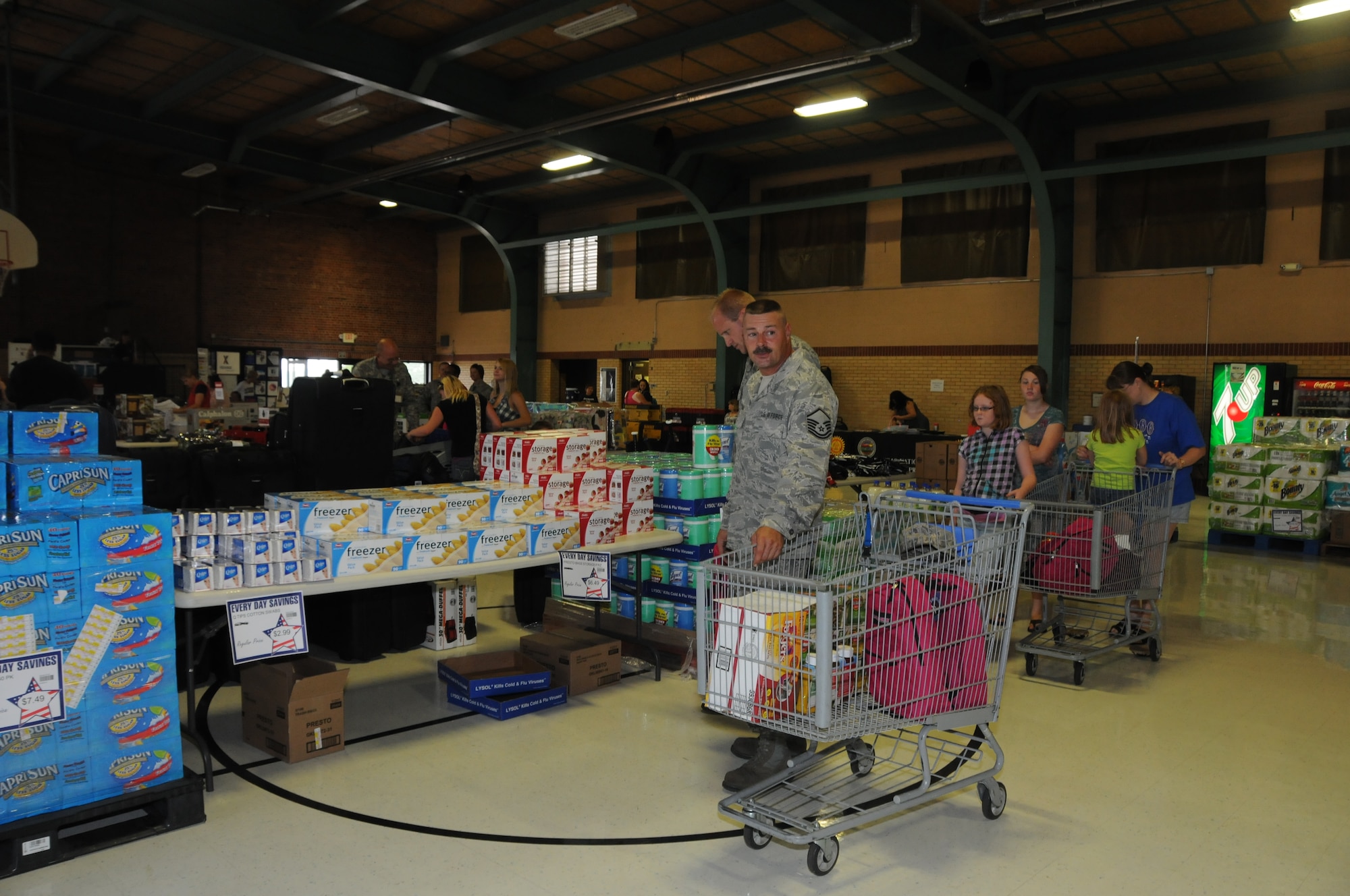 Members of the Kansas National Guard and their families shop for bargains at the 
190th Air Refueling Wing sponsored AAFES and DeCA sale held during the August 2011 UTA. During the two day sale over $48,000 worth of commissary and military exchange items were sold (Photo by Tech. Sgt. Mandy Johnson).