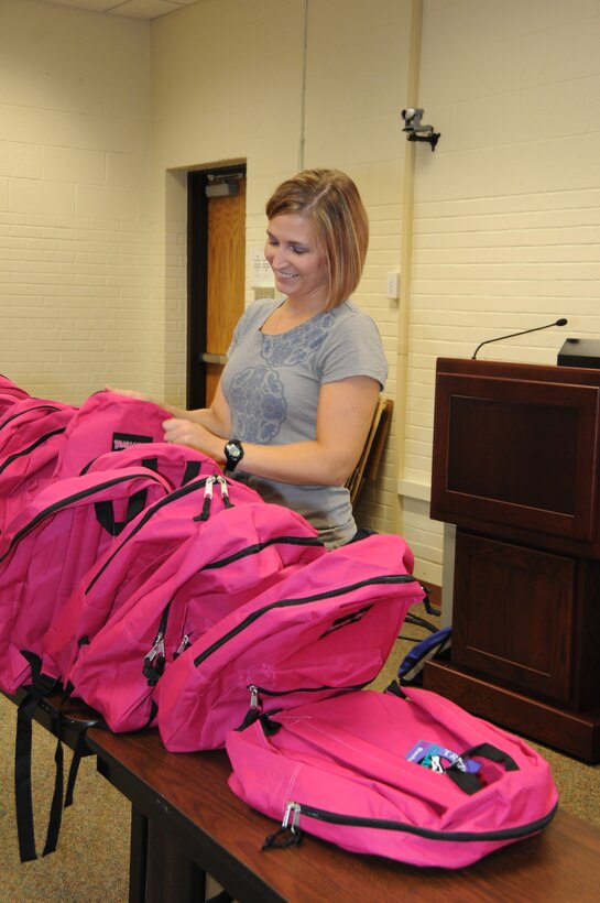 Backpacks are prepared for the multiple children and parents who will later take part in the back to school event held at the Joint Force Headquarters during the August 2011 UTA (Photo by Tech Sgt. Mandy Johnson).