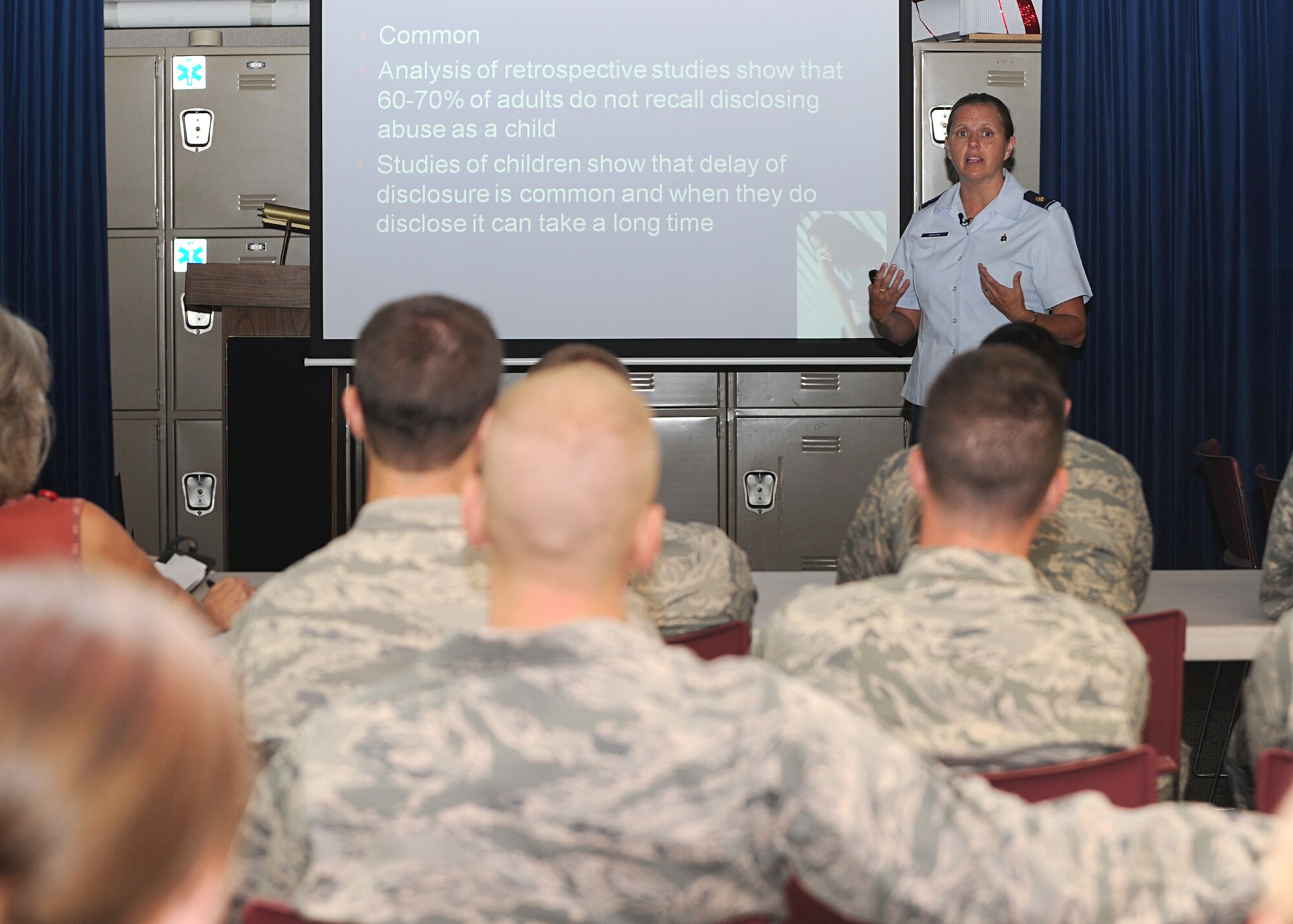 Maj. (Dr.) Shelly Martin, Lackland Air Force Base child abuse pediatrician, discusses information about children maltreatment to 22nd Medical Group members at the base clinic Aug. 30, 2011, McConnell Air Force Base, Kan.  Martin visited McConnell to inform medical and legal career Airmen on procedures that can assist in identifying and handling child abuse cases.  Martin is the only board-certified fellow in child abuse and neglect in the U.S. Air Force, and one of five in the Department of Defense.  (U.S. Air Force photo by Senior Airman Maria A. Ruiz)