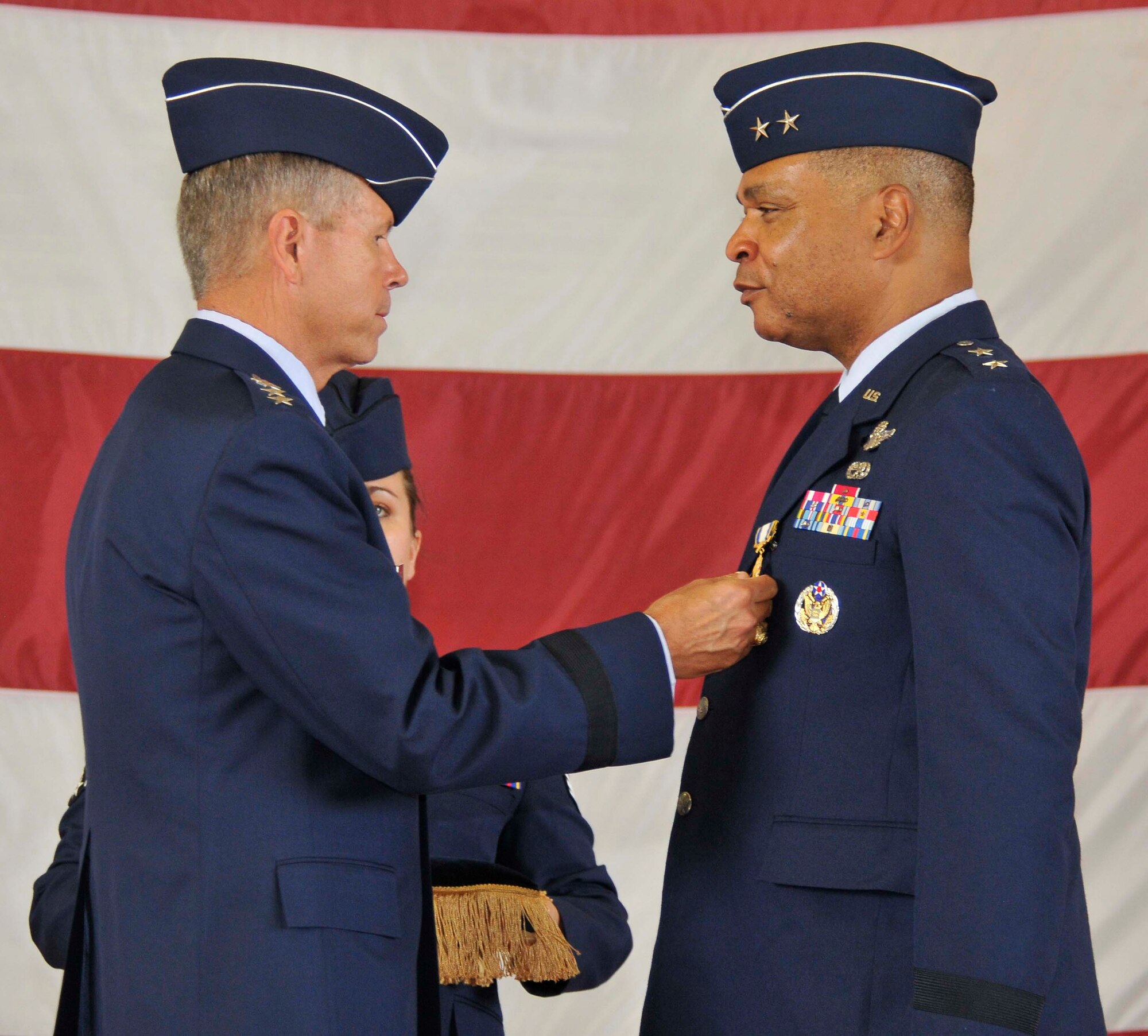 Gen. William M. Fraser, left, Air Combat Command commander, pins a Distinguished Service Medal on Maj. Gen. Garry C. Dean during the Continental U.S. North American Aerospace Defense Command Region-1st Air Force (Air Forces Northern) change of command ceremony at Tyndall Air Force Base, Fla., Aug. 31. Dean relinquished command of CONR-1st AF (AFNORTH) to Lt. Gen. Sid Clarke, marking the first time a lieutenant general has ever held a command billet at Tyndall. (U.S. Air Force photo by Lisa Norman)