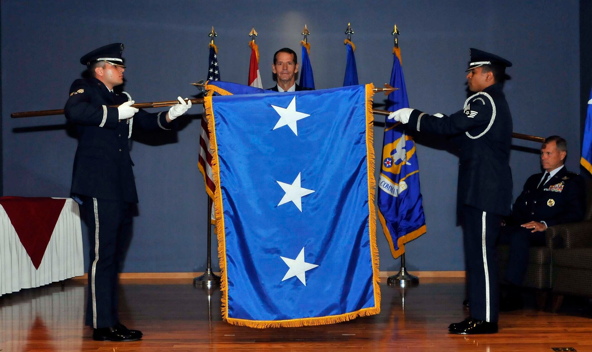 Members of the Tyndall Air Force Base honor guard furl a 2-star flag and unfurl a 3-star flag in honor of Lt. Gen. Sid Clarke’s promotion. Clarke received his third star Aug. 31 immediately before assuming command of Continental U.S. North American Aerospace Defense Command Region-1st Air Force (Air Forces Northern) and making history as the first lieutenant general to ever hold a command billet at Tyndall. (U.S. Air Force photo by Lisa Norman)