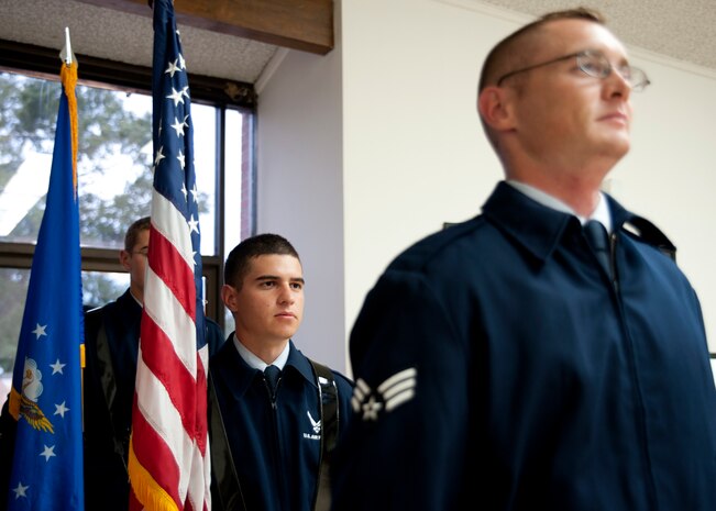 Joint Base Charleston Honor Guard members stand at attention before practicing Posting the Colors at JB CHS - Air Base Aug. 26. The members continually practice to ensure their moves are perfected prior to any ceremony at which they perform. (U.S. Air Force photo/Staff Sgt. Katie Gieratz)
