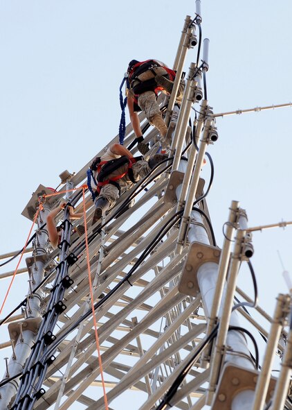 Airmen from the 85th Engineering and Installation Squadron, Keesler Air Force Base, Miss., work on a tower in front of the 2nd Civil Engineer Squadron building on Barksdale AFB, La., Aug. 31. The 85th EIS Airmen are on temporary duty here from Keesler to assist the 2nd Communications Squadron in the construction of the Command Post tower. More than 4,500 feet of cable and 15 antennas were constructed on the tower as part of a construction project to build a permanent home for the Barksdale Command Post. (U.S. Air Force photo/Senior Airman Amber Ashcraft) (RELEASED)