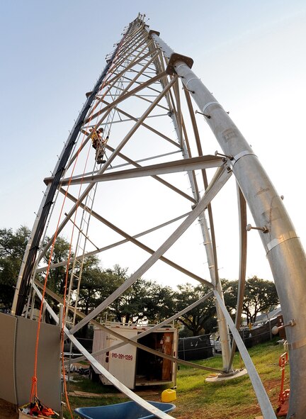 Wearing his safety harness, Senior Airman Matthew Proctor, 85th Engineering and Installation Squadron technician, Keesler Air Force Base, Miss., climbs to the top of the 149-foot Command Post tower on Barksdale AFB, La., Aug. 31. Proctor and two other Keesler Airmen placed the finishing touches on the antennas and cables they installed on the tower several weeks ago. (U.S. Air Force photo/Senior Airman Amber Ashcraft) (RELEASED)