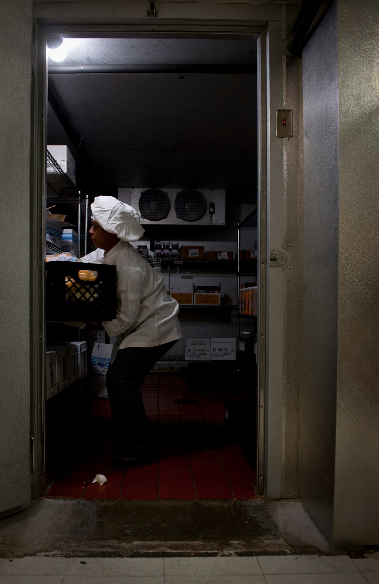 Janice Johnson, 476th Fighter Group air traffic assistant, pulls out a crate from the cooler to collect ingredients for dishes she and her teammate, U.S. Air Force Staff Sgt. Zakia Waters, 23rd Operations Support Squadron, would be cooking during the Iron Chef Competition at Moody Air Force Base, Ga., Aug. 30, 2011. Ms. Johnson and Waters won the competition and were crowned the Iron Chefs. (U.S. Air Force photo by Airman 1st Class Joshua Green/Released)

