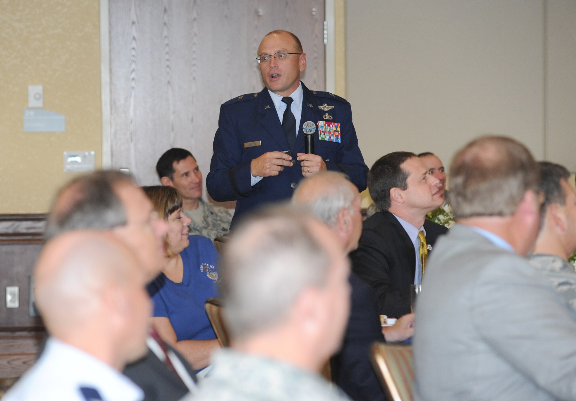 Brig. Gen. Andrew Mueller, 81st Training Wing commander, briefs the audience on Keesler's mission during the Biloxi Chamber of Commerce Morning Call, Aug. 25.  Keesler sponsored the event at the Bay Breeze Event Center as part of the base's 70th birthday celebration.  (U.S. Air Force photo by Kemberly Groue)