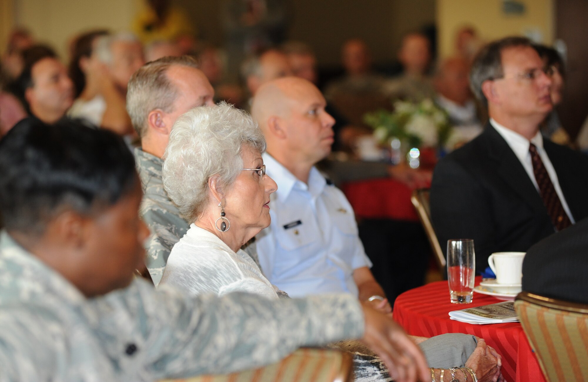 Susan Hunt, Biloxi Public Schools, and other guests listen to opening remarks during the Biloxi Chamber of Commerce Morning Call, Aug. 25.  Keesler sponsored the event at the Bay Breeze Event Center as part of the base's 70th birthday celebration.  (U.S. Air Force photo by Kemberly Groue)