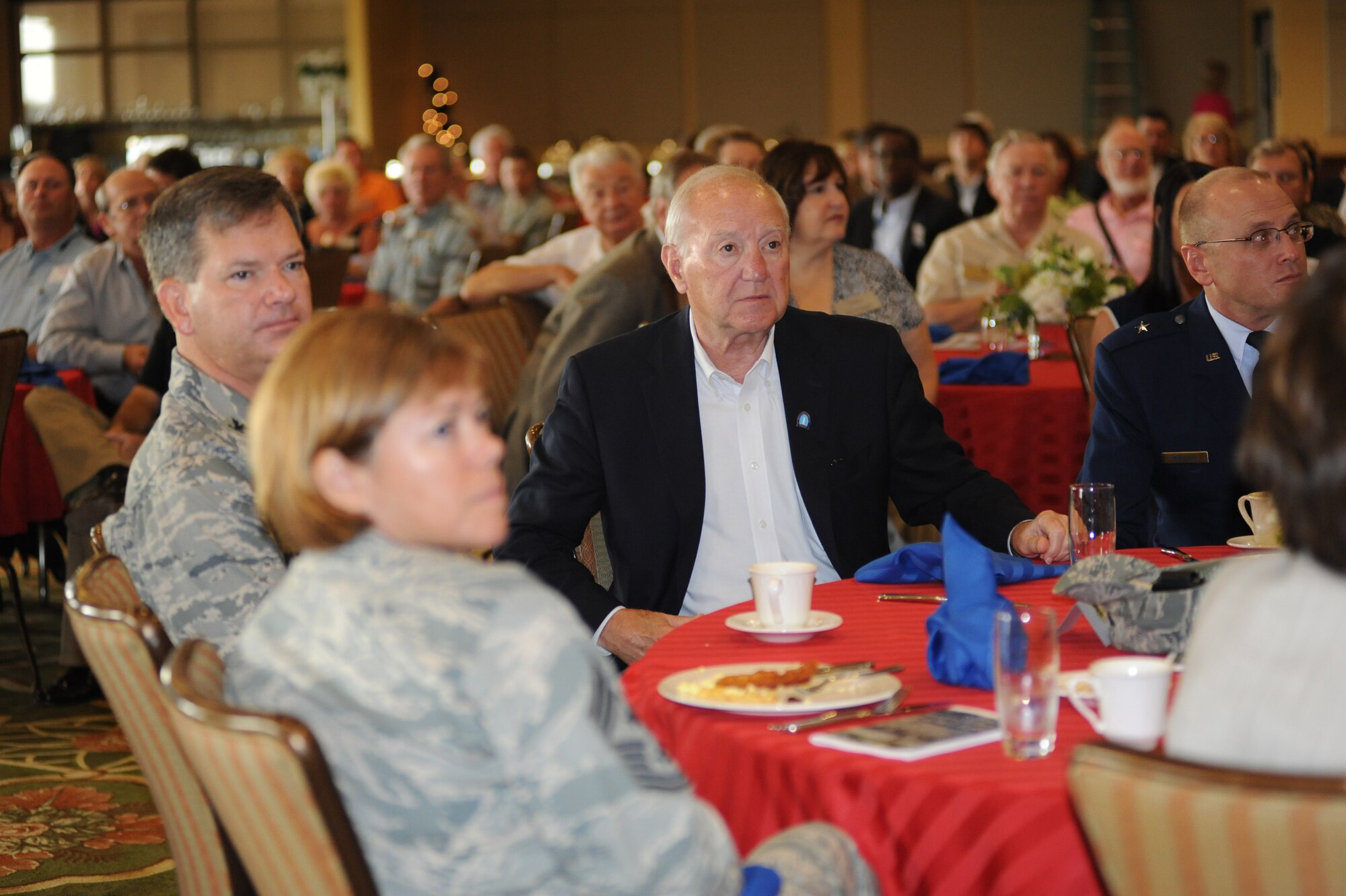 Biloxi Mayor A.J. Holloway and other guests listen to opening remarks during the Biloxi Chamber of Commerce Morning Call, Aug. 25.  Keesler sponsored the event at the Bay Breeze Event Center as part of the base's 70th birthday celebration.  (U.S. Air Force photo by Kemberly Groue)
