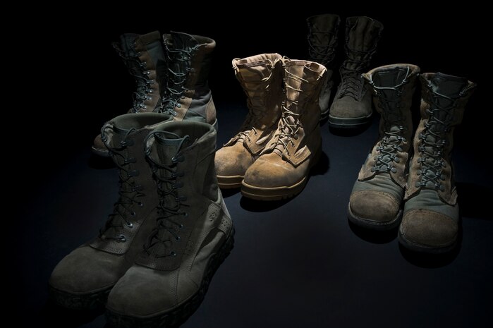 A variety of military boots are set out Aug. 30, 2011, at Nellis Air Force Base, Nev. The new Air Force Instruction 36-2903, which was revised July 13, 2011, states Airmen are not allowed to wear tan boots effective 1 November 2011, tan boots will not be worn with the ABU unless authorized by the Theater commander for wear only in theater. The tan boot may be worn with the desert flight duty uniform indefinitely. (U.S. Air Force photo by Airman 1st Class Daniel Hughes/Released)