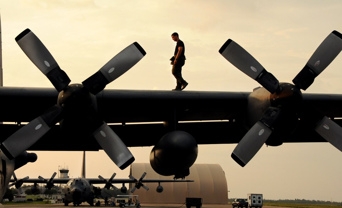 Staff Sgt. Cris Hunter, a flight engineer for 711th Special Operations Squadron, walks on the wing of a MC-130E Talon I to check for malfunctions prior to a training mission on Duke Field, Fla. The flight engineer monitors the aircraft systems and calculates performance capabilities of the aircraft. The 711th SOS, part of the 919th Special Operations Wing, conducts flight training missions five days a week to maintain currency on all of their readiness requirements. (U.S. Air Force photo/Tech. Sgt. Cheryl Foster)