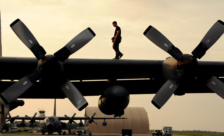 Staff Sgt. Cris Hunter, a flight engineer for 711th Special Operations Squadron, walks on the wing of a MC-130E Talon I to check for malfunctions prior to a training mission on Duke Field, Fla. The flight engineer monitors the aircraft systems and calculates performance capabilities of the aircraft. The 711th SOS, part of the 919th Special Operations Wing, conducts flight training missions five days a week to maintain currency on all of their readiness requirements. (U.S. Air Force photo/Tech. Sgt. Cheryl Foster)