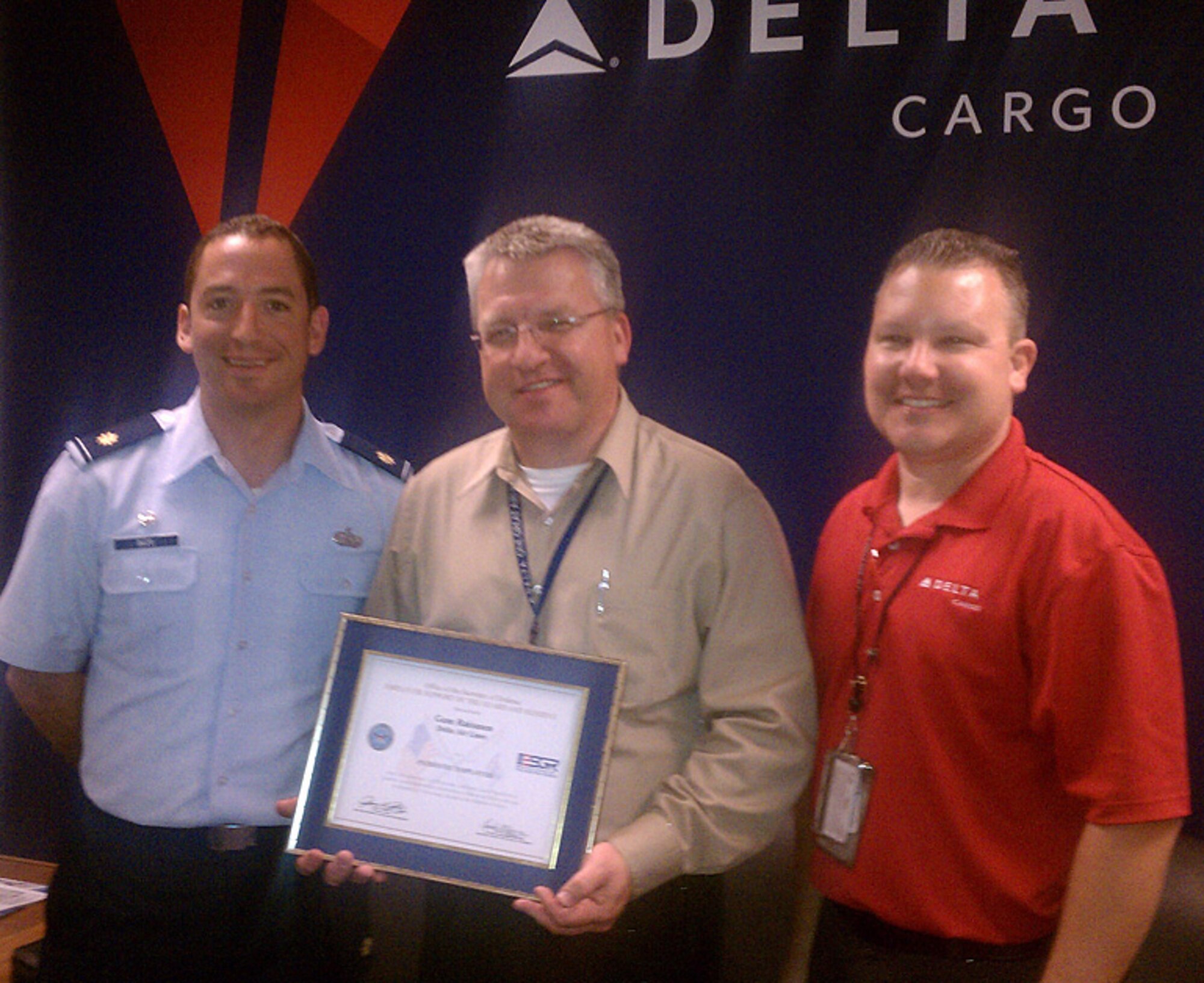 Left to right: Lt. Col. Christopher Buzo, Gary Raisanen, and Master Sgt. Patrick Haley are all smiles after the Washington Employer Support for Guard and Reserve committee presented the Patriot Award to Raisanen, an operations manager for Delta Air Lines cargo operations.  Haley, who nominated Raisanen for the award, is assigned to the 446th Civil Engineer Squadron, Joint Base Lewis-McChord, Wash.  Buzo is the 446th CES commander. (Courtesy photo)