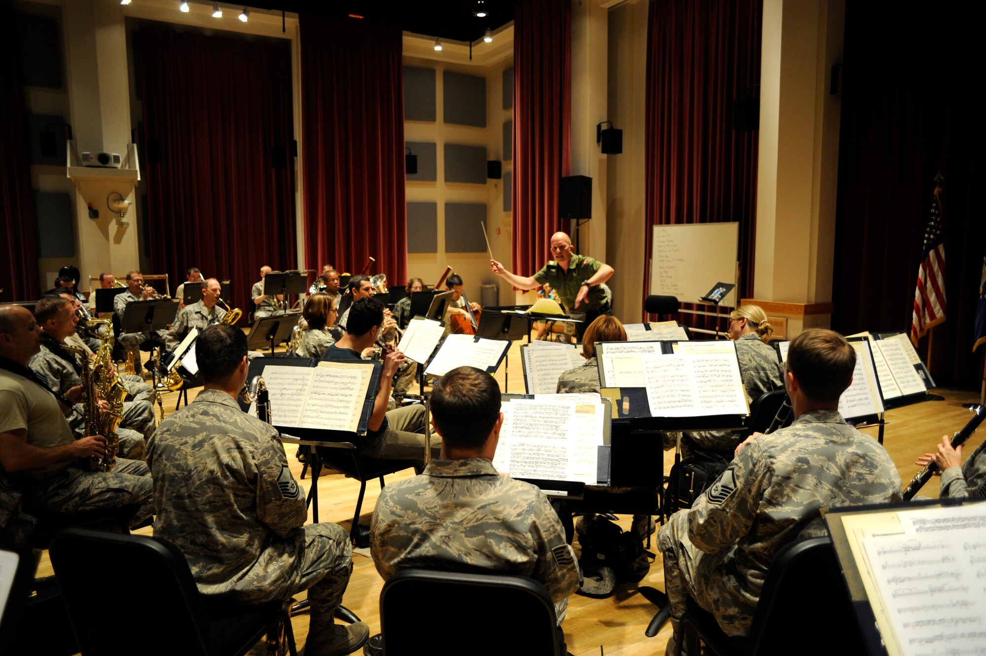 International guest conductor from Denmark, Captain Martin Åkerwall, rehearses with the U.S. Air Force Concert Band in Gabriel Hall on August 11, for an upcoming concert at the U.S. Capitol. Captain Åkerwall is the conductor of the Band of the Royal Danish Life Guards.
