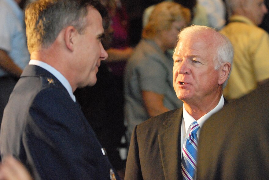 Maj. Gen Robert McMahon, Robins Air Logistics Center commander, speaks with U.S. Senator Saxby Chambliss, R-Ga, before the Robins Region Progress Report at the Museum of Aviation Monday. U. S. Air Force photo by Sue Sapp