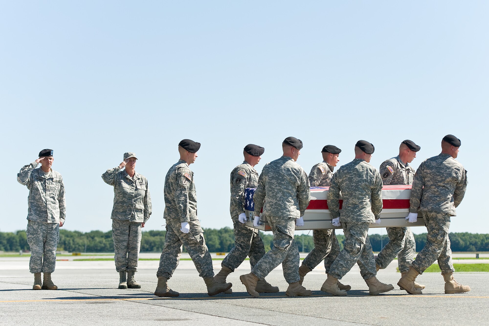 A U.S. Army carry team transfers the remains of Army Spc. Douglas J. Green, of Sterling, Va., at Dover Air Force Base, Del., Aug. 30, 2011. Green was assigned to the 3rd Battalion, 21st Infantry Regiment, 1st Stryker Brigade Combat Team, 25th Infantry Division, Fort Wainwright, Alaska. (U.S. Air Force photo/Roland Balik)