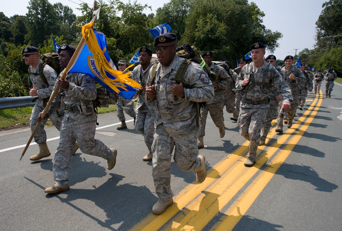 Langley Air Force Base Airmen run to a checkpoint during the Security Forces 9/11 Ruck March to Remember in Amherst, Va., Aug. 25, 2011.  Airmen from Langley AFB marched 141 miles of the 2,181-mile course originating in Texas and ending in New York Sept. 11. (U.S. Air Force photo by Tech. Sgt. Barry Loo/Released)