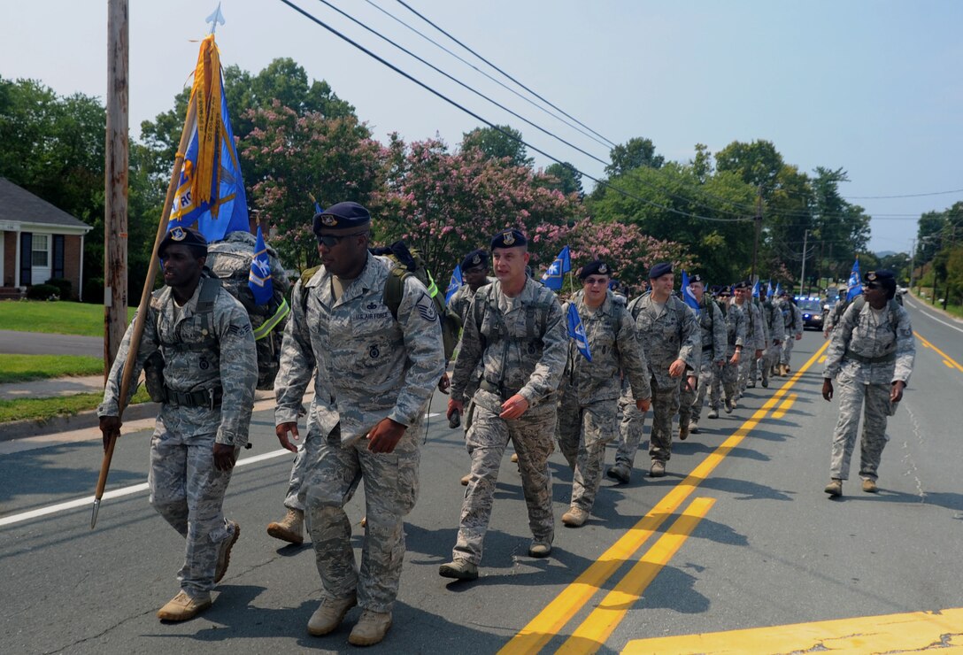 Airmen from Langley Air Force Base, Va., honor fallen defenders by marching through the streets of Amherst, Va., during the Security Forces 9/11 Ruck March to Remember Aug. 25, 2011. Langley AFB Airmen traveled 141 of the 2,181 miles to pay their respects to the fallen defenders of Operation Enduring Freedom. (U.S. Air Force photo by Airman 1st Class Racheal Watson/Released)