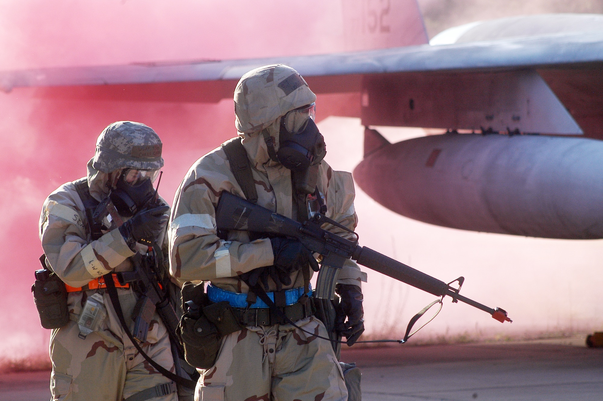 Team members participating in the 402nd EDMX exercise perform a Post Attack Reconnaissance after a simulated attack on their base. U. S. Air Force photo by Sue Sapp