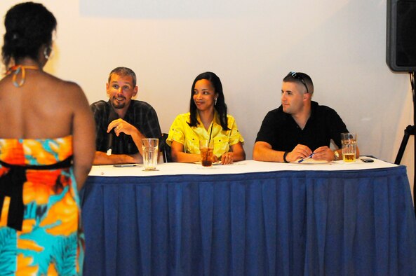 Staff Sgt. Alexis Sellers, contestant in the Aug. 25 Robins Idol competition, listens to comments from judges Michael Starkey aka "Simon", Tech Sgt. Angela Jones, and Senior Airman Kyle Goldberg. U. S. Air Force photo by Sue Sapp 

