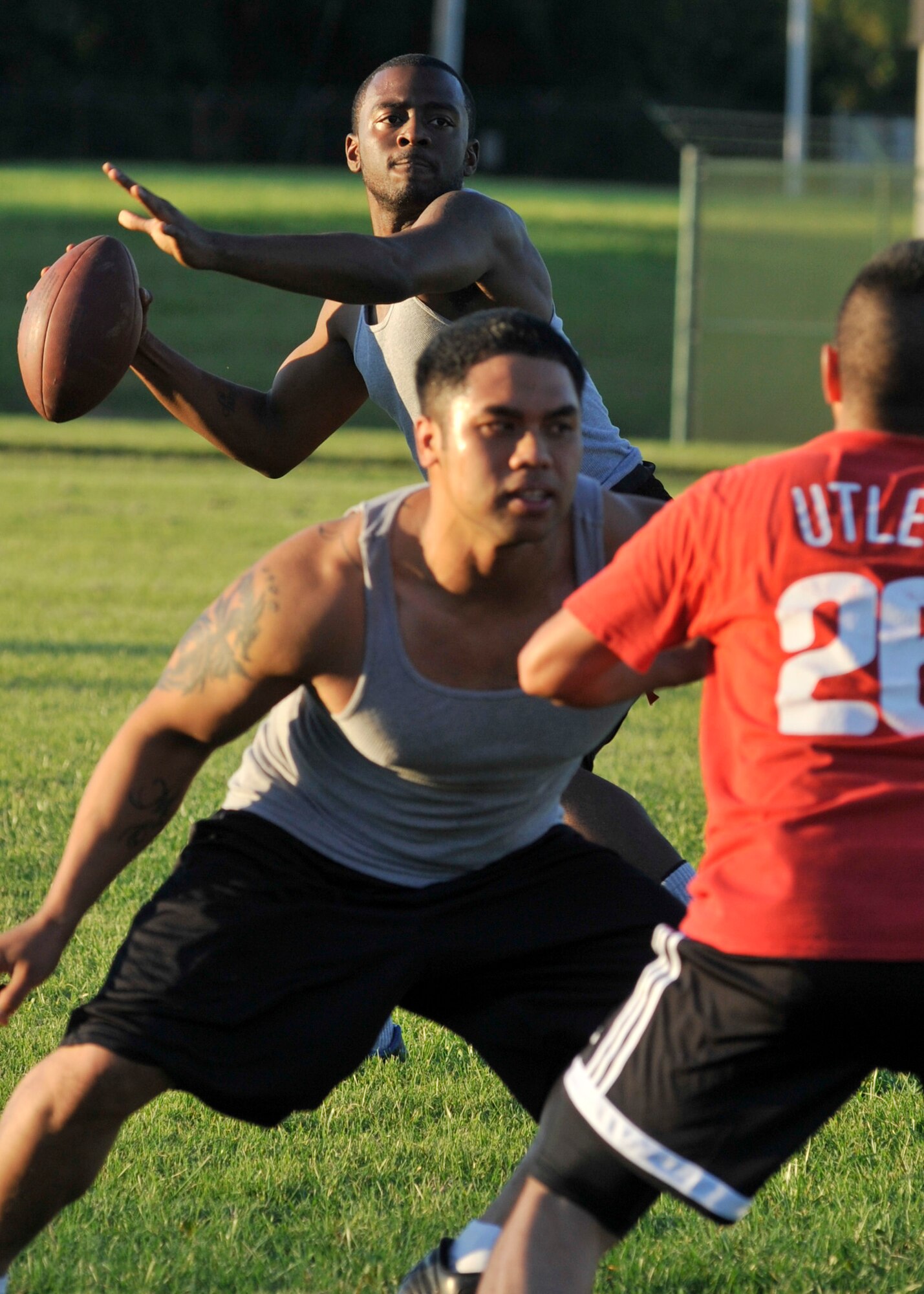Greg Gilbert, quarterback for the 436th Logistics Readiness Squadron, drops back to pass during a flag football scrimmage with the 436th Civil Engineer Squadron at Dover Air Force Base, Del., Aug. 30. Both teams held a scrimmage since games were cancelled due to Hurricane Irene. (U.S. Air Force photo by Tech. Sgt. Chuck Walker)
