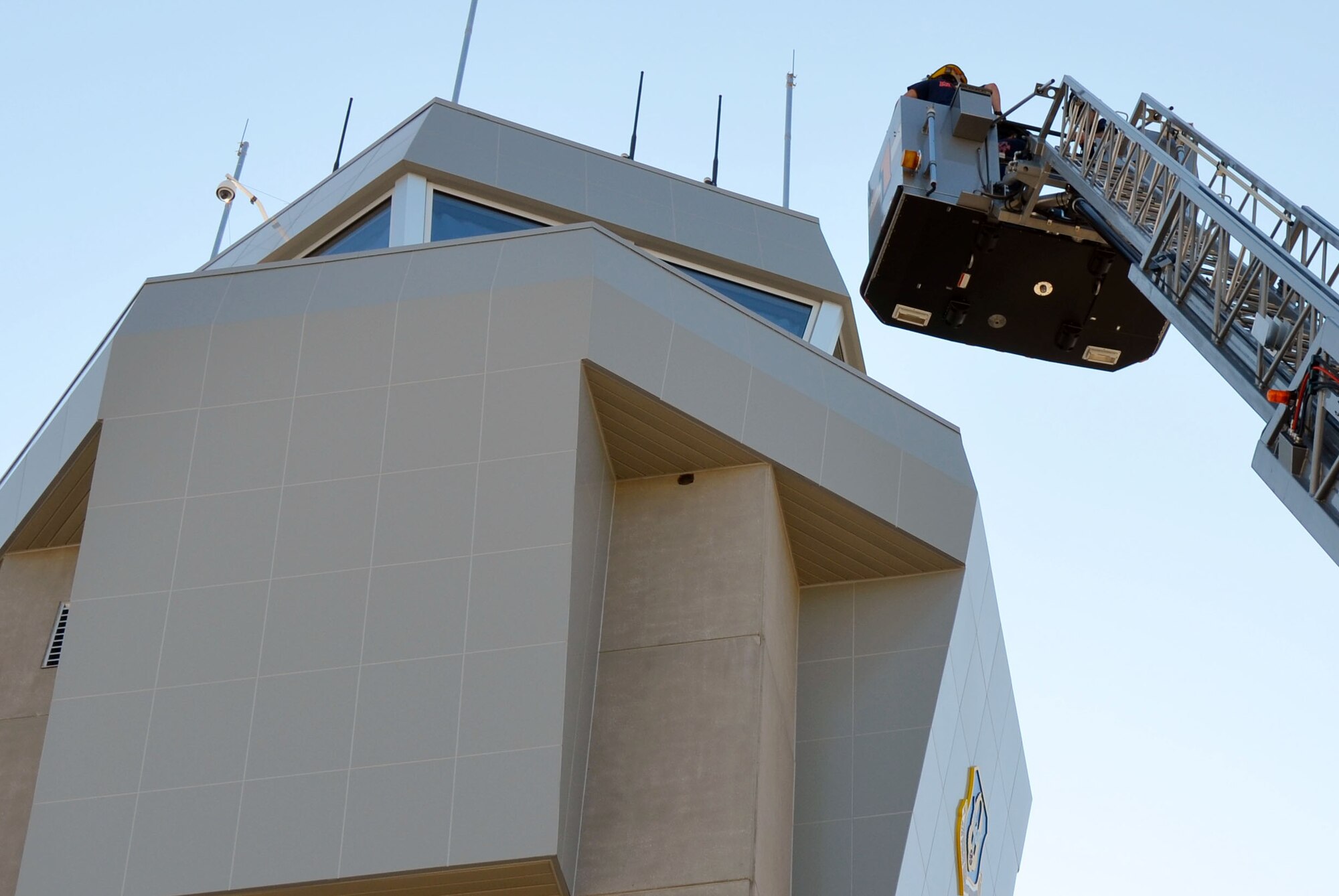 Fire teams conduct aerial ladder placement training here Aug. 23-24. (U.S. Air Force Photo/Don Peek)