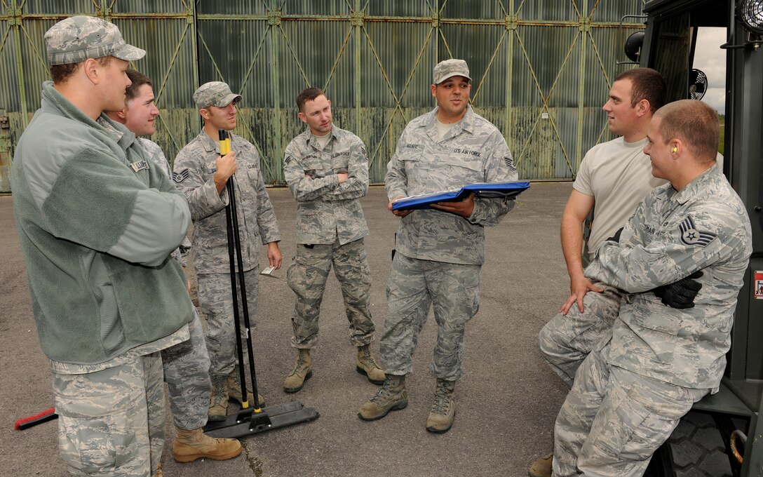 RAF WELFORD, United Kingdom - Staff Sgt. Joshua Aguirre, 420th Munitions Squadron, conducts a safety briefing prior to loading weapons for movement. Auguirre was recently named the August 501st Combat Support Wing Everyday Hero from the 422nd Air Base Group. (U.S. Air Force photo by Tech. Sgt. John Barton)