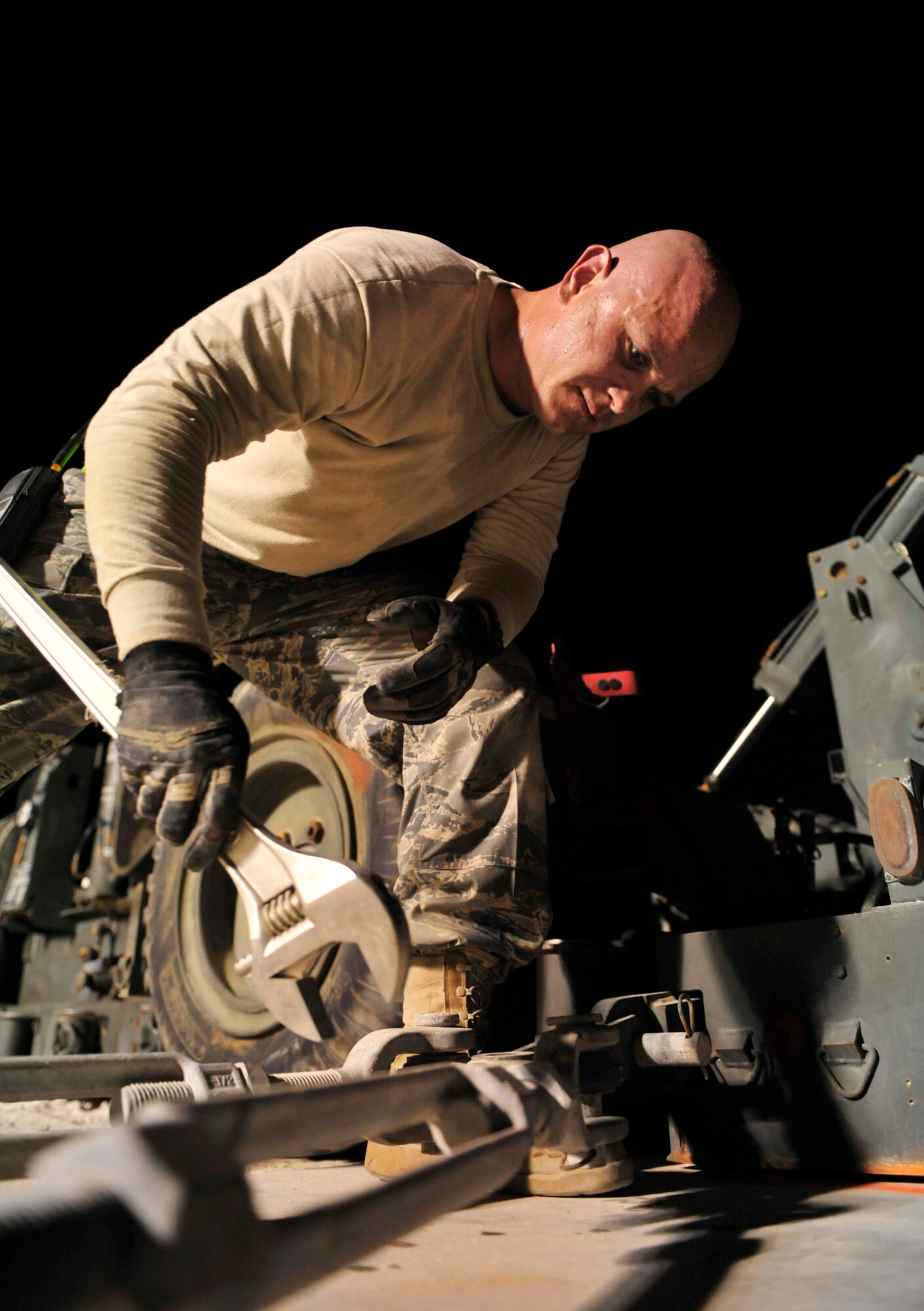 Staff Sgt. Brian Seabolt, from the 380th Expeditionary Civil Engineer Squadron, tightens a bolt on the mobile aircraft arresting system, Aug. 27, 2011, during a two-week maintenance overhaul of the system at an air base in Southwest Asia. This maintenance is due every 10 years. The MAAS is an emergency braking system for tail-hook-equipped aircraft used in emergency situations where a fighter aircraft needs assistance coming to a stop after flight. This occasionally occurs due to mechanical failures beyond the pilot's abilities to correct prior to landing. (U.S. Air Force photo/Tech. Sgt. Patrick Mitchell)
