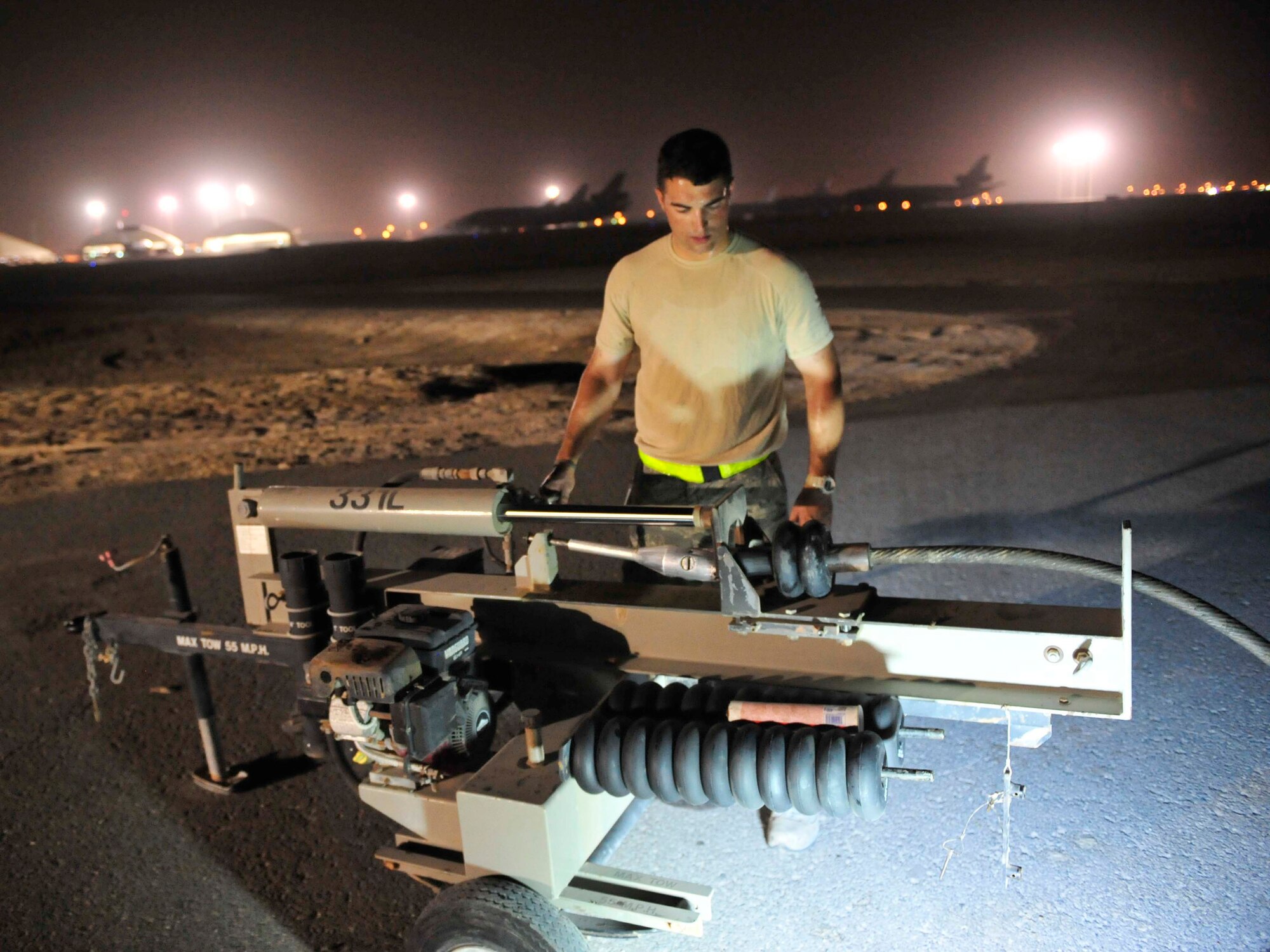Senior Airman Jason Senter, from the 380th Expeditionary Civil Engineer Squadron, installs cable spacers on the mobile aircraft arresting system, Aug. 27, 2011, during a two-week maintenance overhaul of the system at an air base in Southwest Asia. This maintenance is due every 10 years. The MAAS is an emergency braking system for tail-hook-equipped aircraft. It is used in emergency situations where a fighter aircraft needs assistance with coming to a stop after flight. This occasionally occurs due to mechanical failures beyond the pilot?s abilities to correct prior to landing.  (U.S. Air Force photo/Tech. Sgt. Patrick Mitchell)