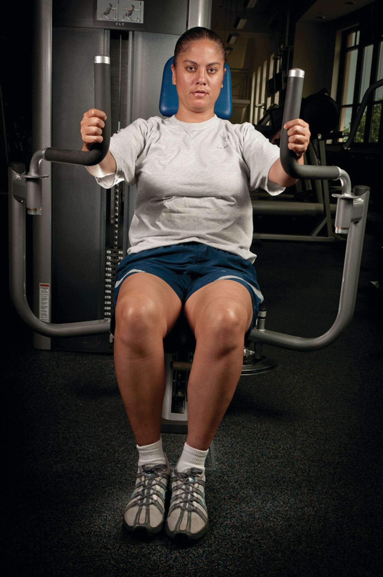 Staff Sgt. Alohil Perry-Peters, 65th Medical Group, lifts weights during a workout session at the Lajes Fitness Center Aug. 22, 2011.  (Photo by Lucas Silva)
