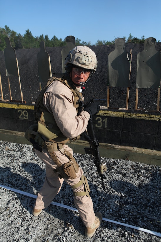 Chief Petty Officer 1st Class Lee Boujie, a special amphibious reconnaissance corpsman with the 24th MEU’s Force Reconnaissance Platoon, scans the area after shooting a drill during the Special Operations Training Group’s Close Quarters Tactics course Aug. 31, on Stone Bay’s Multi Purpose Range. The course is part of a pipeline of courses, conducted by SOTG, meant to prepare the Marines for the missions they may conduct while deployed with the 24th Marine Expeditionary Unit.