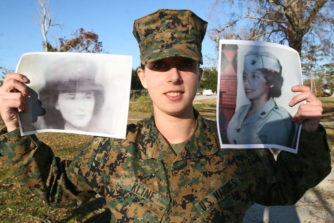 Lance Cpl. Richelle D. Kline, an administration specialist for Headquarters Battalion, 2nd Marine Division, holds a picture of her grandmother (left) and mother (right) in their Marine Corps service uniforms, aboard Marine Corps Base Camp Lejeune, N.C., Dec. 1. Kline is a third generation Marine and hopes that when she has children that they follow in the family tradition.