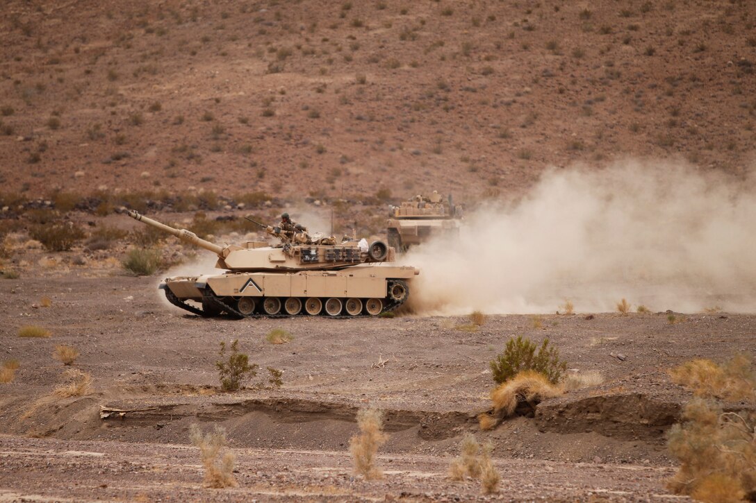 Marines with Co. A, 1st Tank Battalion, roll through the Combat Center training area during a patrol training exercise Dec. 1, 2011. This field exercise is the last time the company will be in the field training before they deploy to Afghanistan.