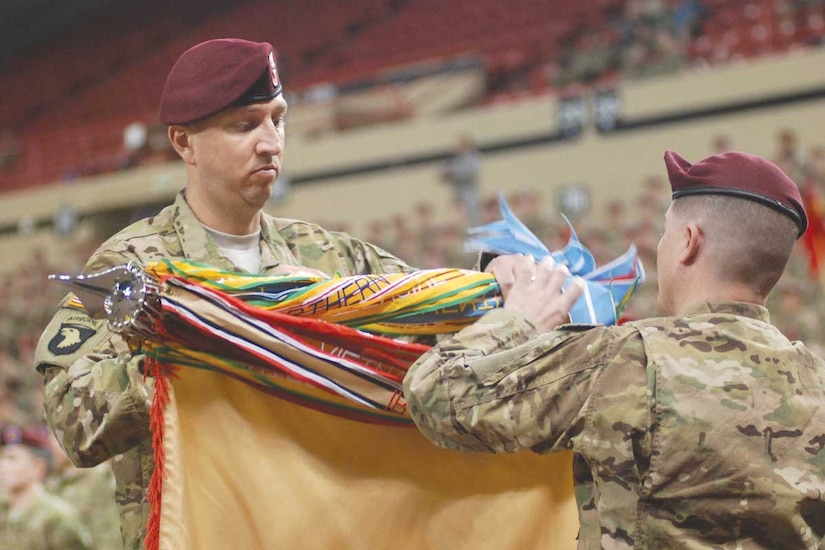 Army Lt. Col. John Hinson, 725th Brigade Support Battalion, commander, and Command Sgt. Maj. Brian Morrison case their unit colors at the deployment ceremony for the 4th Brigade Combat Team (Airborne), 25th Infantry Division, at Sullivan Arena in Anchorage Tuesday. (U.S. Army photo/Staff Sgt. Matthew Winstead)