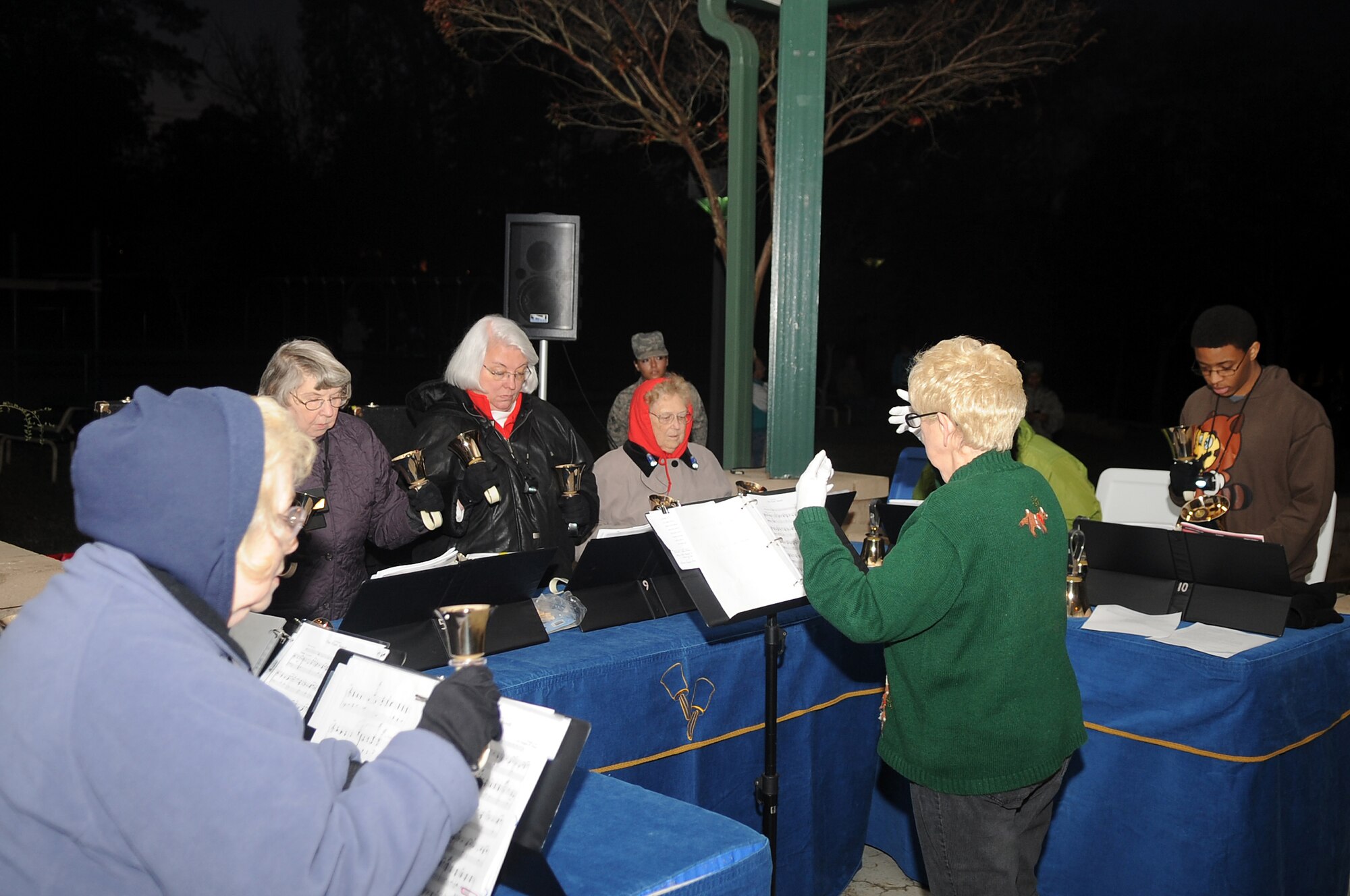 The Handbell and Chancel choir perform for the Christmas Tree Lighting Ceremony, Shaw Air Force Base, S.C., Nov. 30, 2011. The Christmas Tree Lighting Ceremony was put together by Shaw's Chaplains, and is held annually to signify the beginning of Christmas holiday activities. (U.S. Air Force photo by Airman First Class Hunter Brady/Released)







