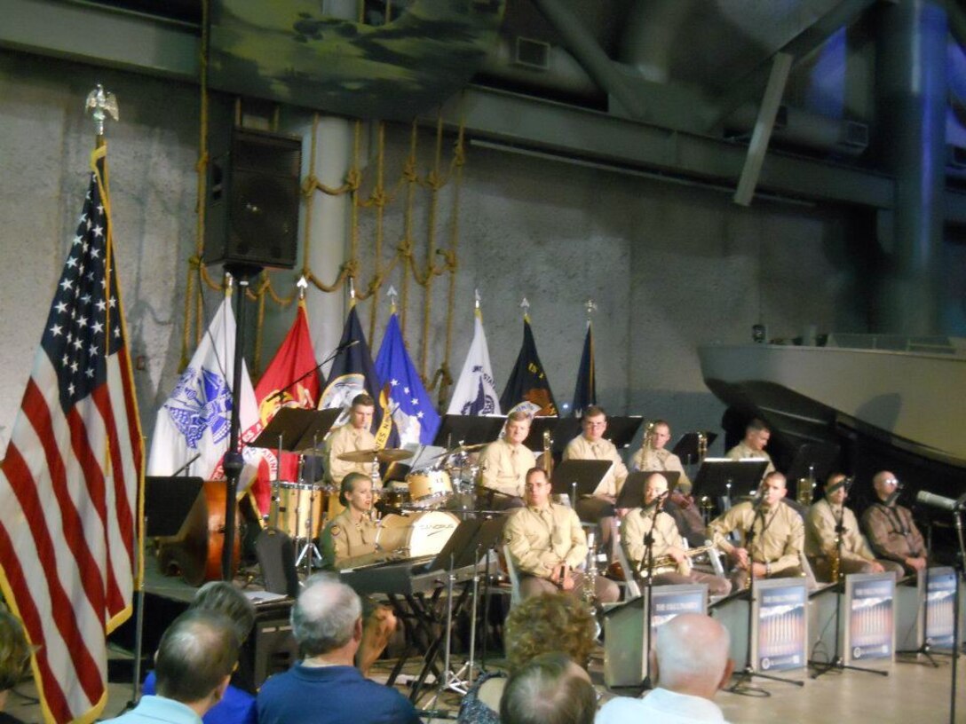 TSgt Krista Joyce accompanies herself as she sings a moving dedication to the many veterans who lost their lives during WWII.