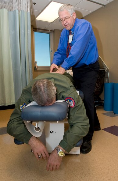 Dr. Philip Hardinger, 2nd Medical Group chiropractor, works on the spine of Col. Jeffrey Lamers, Air Force Global Strike Command, on Barksdale Air Force Base, La., Nov. 30. Hardinger used several chiropractic techniques to relieve Lamers' back pain. (U.S. Air Force photo/Airman 1st Class Benjamin Gonsier)(RELEASED)