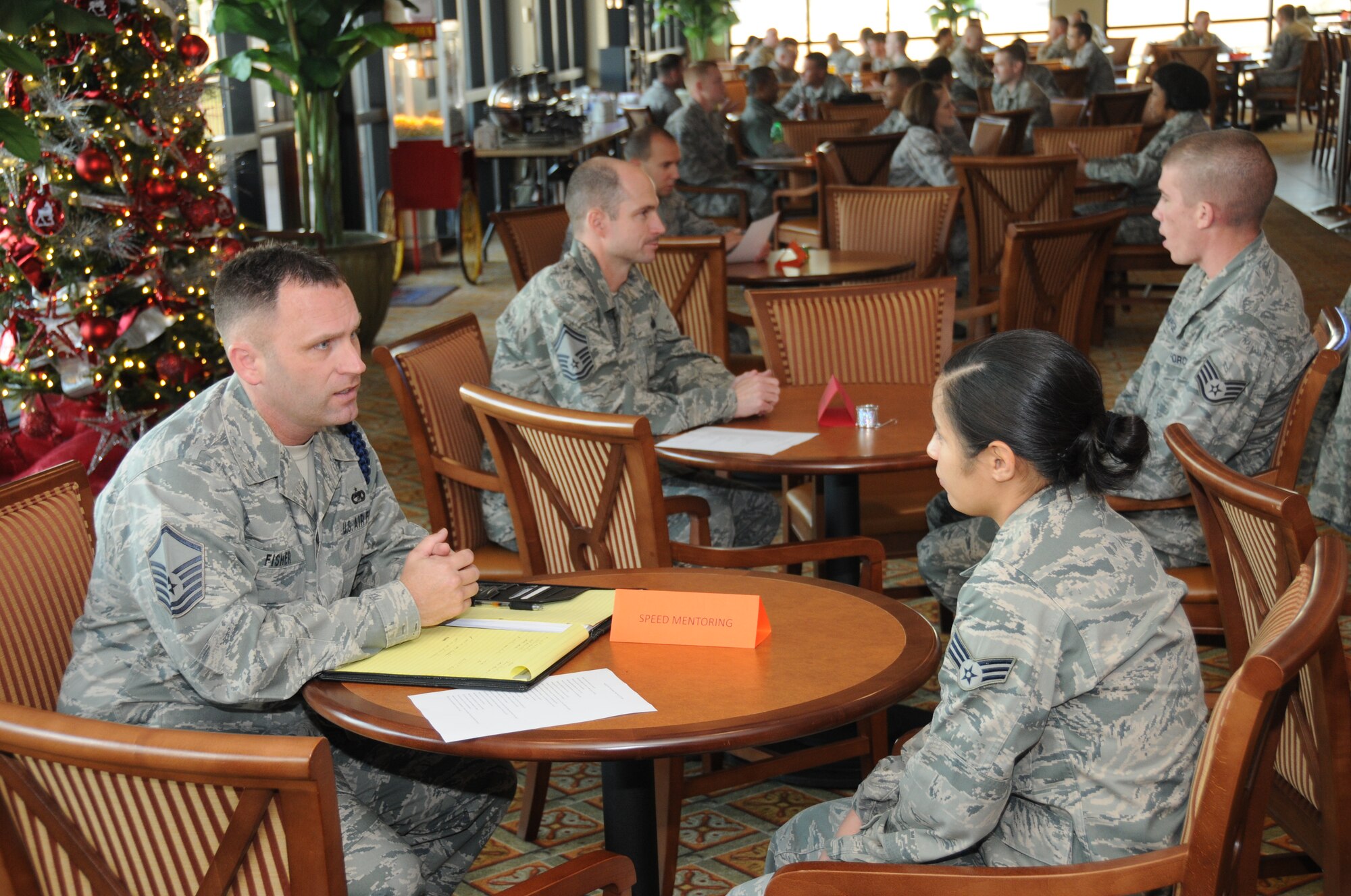 Master Sgt. Anthony Fisher, 81st Training Group, gives mentoring advise to Senior Amn. Jenifer Mathes, 81st Surgical Operations Squadron, during a speed mentoring program at the Bay Breeze Event Center, Keesler Air Force Base, Miss., Nov. 30, 2011.  The program was organized by the Keesler Career Assistance advisor, Senior Master Sgt. Steven Mullens, to provide mentorship to Airman Leadership School students from various senior NCOs.  (U.S. Air Force photo by Kemberly Groue)