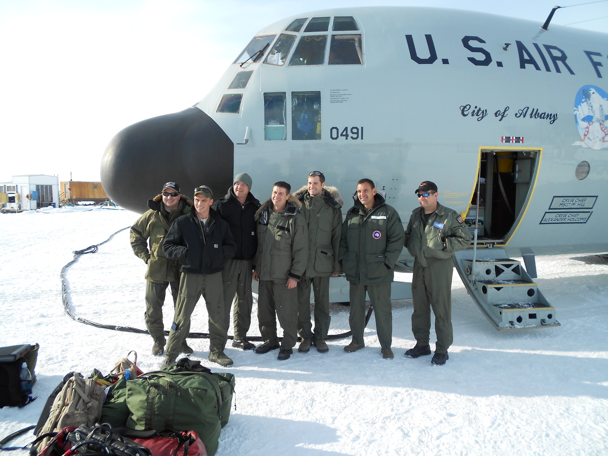 McMURDO STATION, Antarctica--Lt Gen Ted Kresge, Commander, Joint Task Force-Support Forces Antarctica (JTF-SFA), stands with the crew from Skier 21 after returning from at re-supply mission to the South Pole on November 22.  JTF-SFA, through Operation Deep Freeze, provides support to the National Science Foundation, which manages the United States Antarctic Program.
