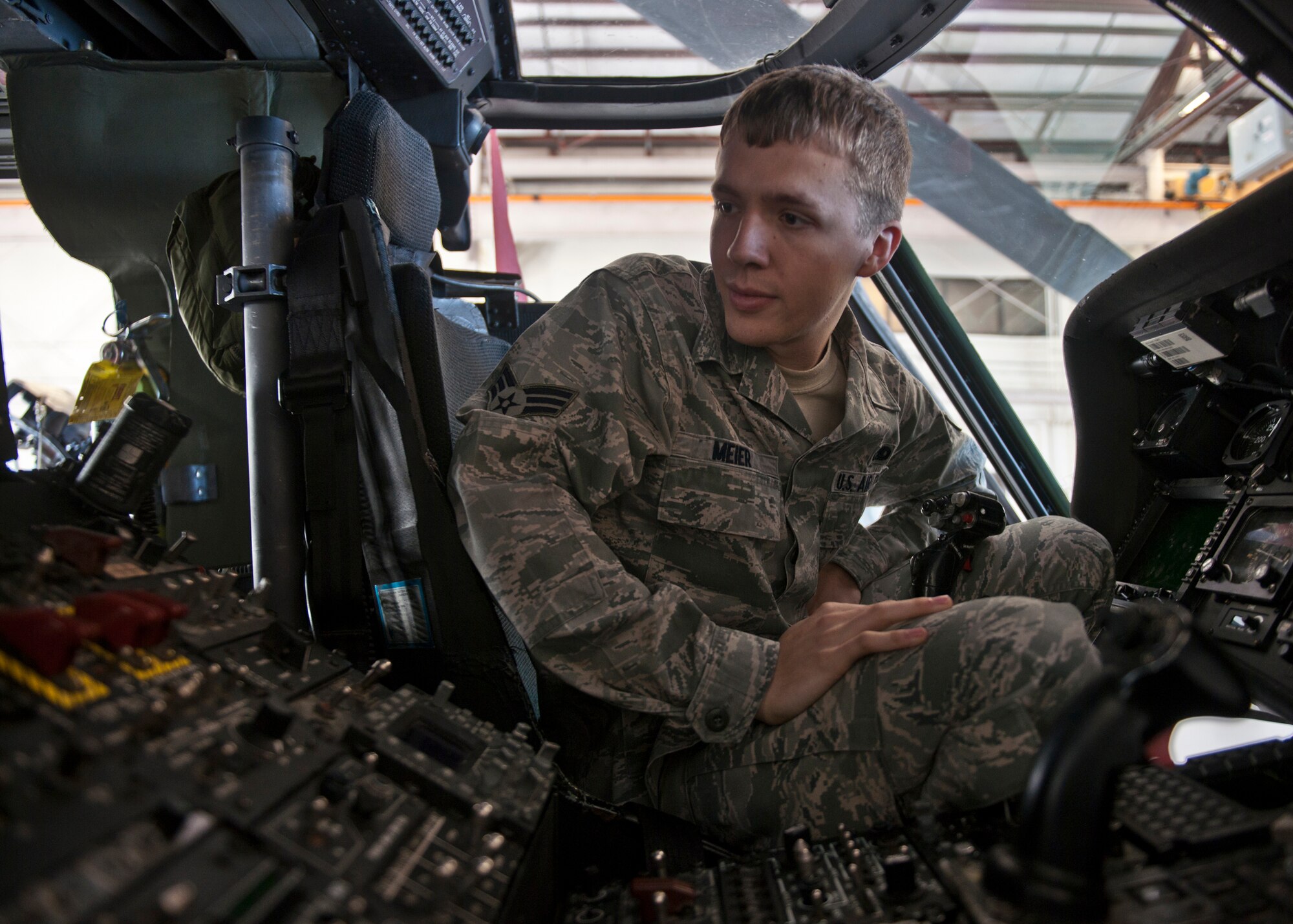U.S. Air Force Senior Airman Kurt Meier, 723rd Aircraft Maintenance Squadron, inspects the cockpit of an HH-60G Pave Hawk as it undergoes maintenance at Moody Air Force Base, Ga., Nov. 30, 2011. The HH-60 is used for personnel recovery both stateside and in deployed environments. Repairing or replacing parts on the aircraft can be costly. This HH-60 recently required a rescue hoist replacement, which is valued at $172,000. (U.S. Air Force photo by Senior Airman Eileen Meier/Released)