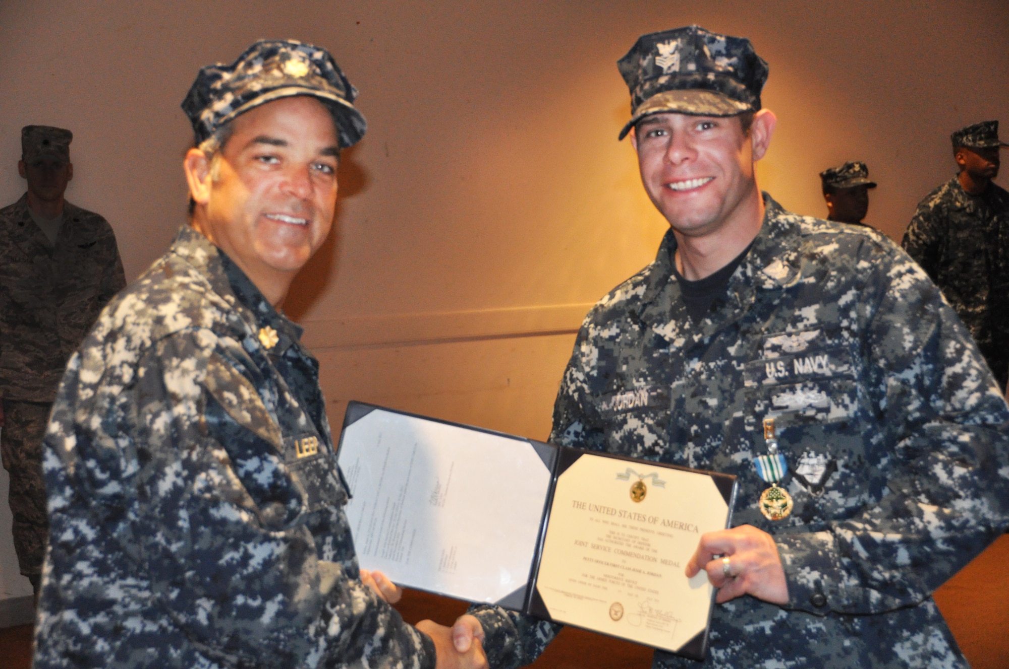 The Joint Unit Commendation Medal was awarded to Petty Officer 1st Class Jesse Jordan by Lt. Cmdr. Brian Leep, Naval Support Activity-Lakehurst executive officer. Jordan earned this honor when serving as the department lead petty officer while deployed to Mobile Operating Operation, Afghanistan. (U.S Navy photo by Petty Officer 2nd Class Darren Grant/Released)